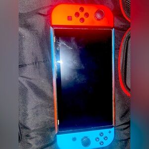 Nintendo switch used no cracks comes with games and controllers and case